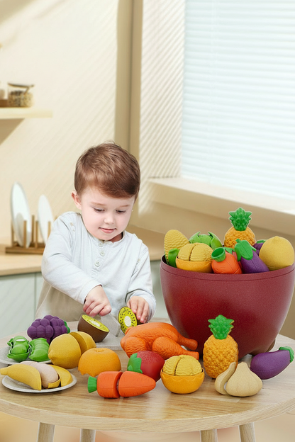 Child playing with toy fruits and vegetables on a table, with Safe material